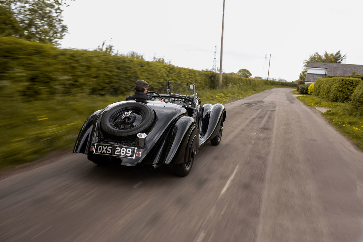 Driving shot of 1938 BMW 328 Roadster offered at RM Sotheby’s Monterey live auction 2022